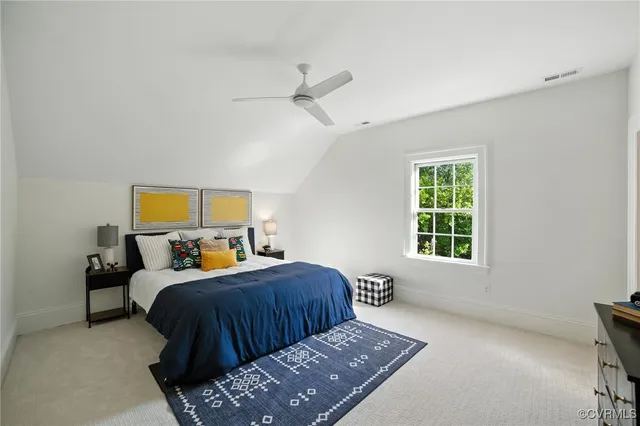 a bed room with a bed and a window