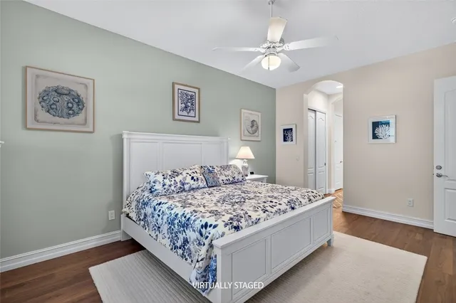 a white toilet sitting next to a bathroom sink