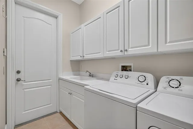 a bedroom with two beds and a window