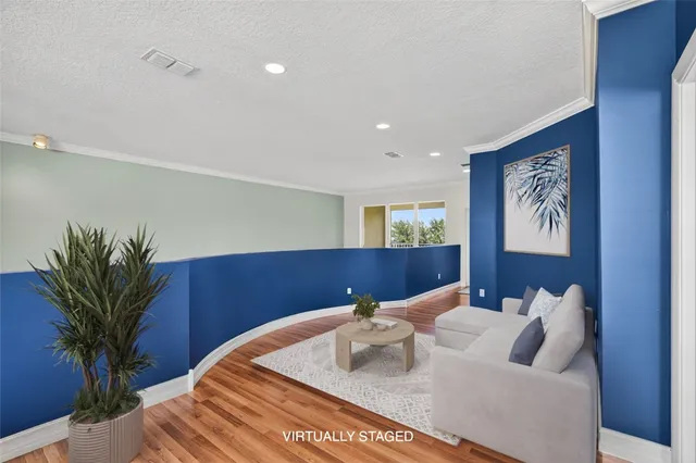 a view of a two chairs in the balcony