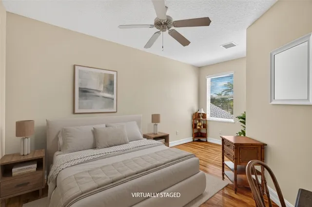 a front view of a house with a yard table and chairs