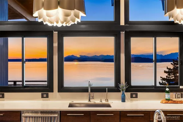 a bathroom with a sink and a large window