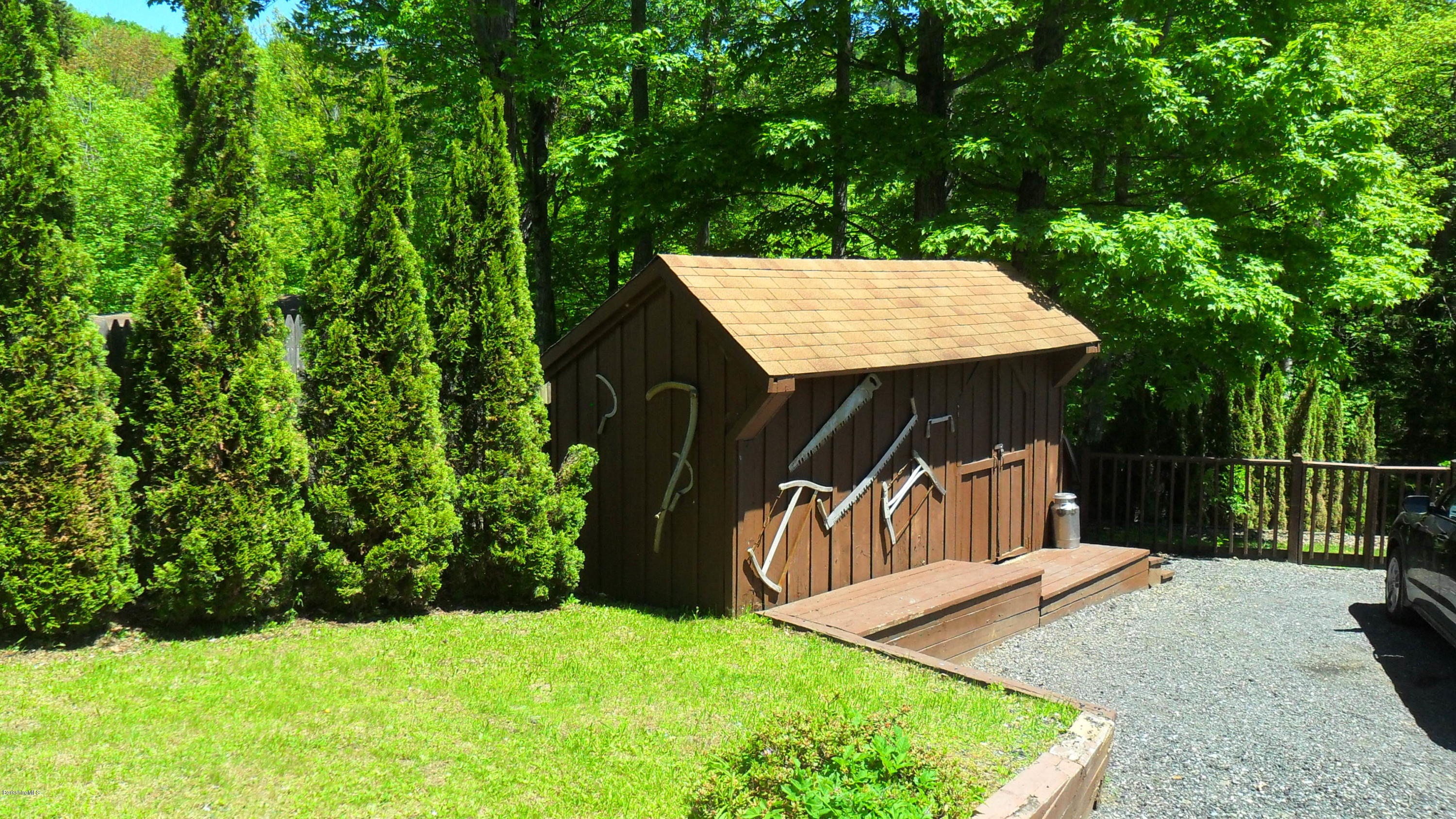 88 Moores Road Florida, MA 01343 - Photo 16 of 53 a view of a backyard with a barn plants and large tree
