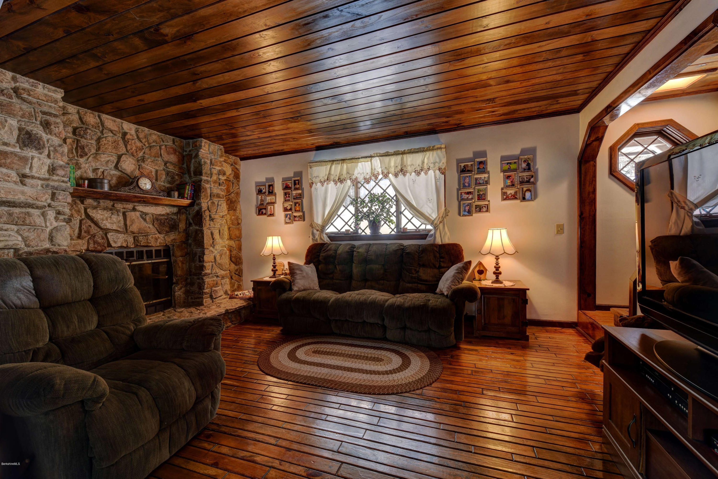 88 Moores Road Florida, MA 01343 - Photo 27 of 53 a living room with furniture and a flat screen tv