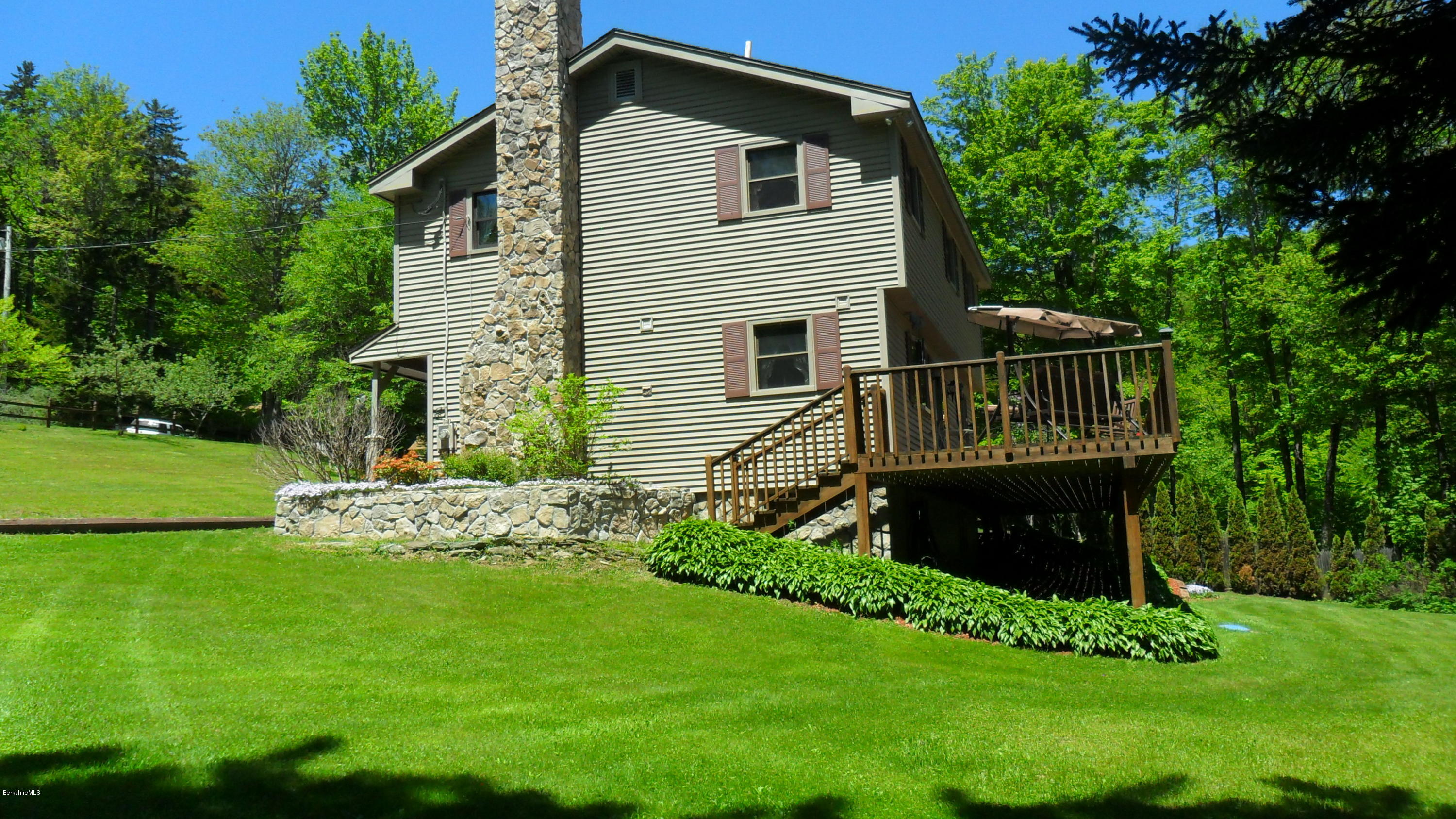 88 Moores Road Florida, MA 01343 - Photo 4 of 53 a front view of a house with a garden