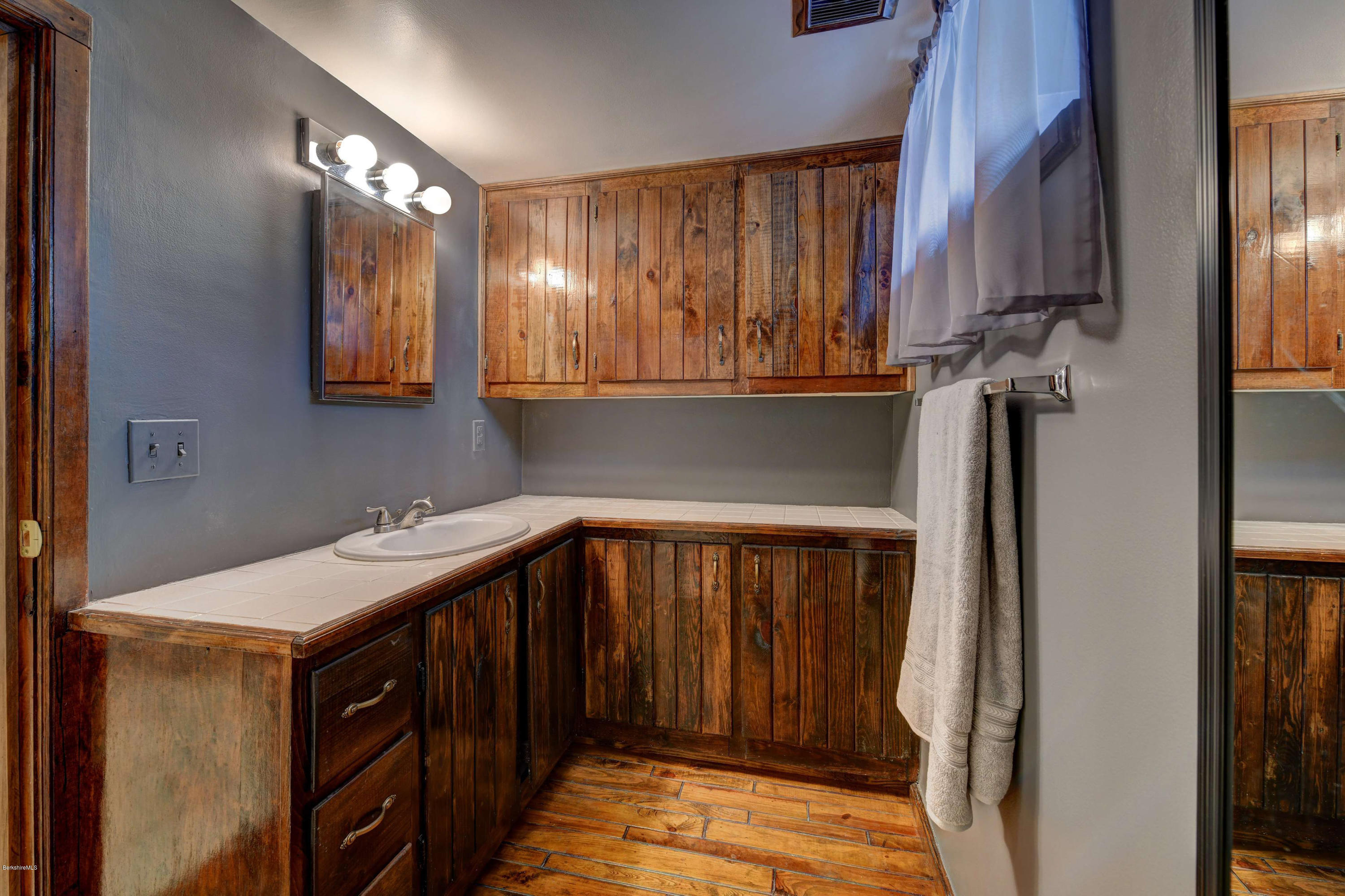 88 Moores Road Florida, MA 01343 - Photo 49 of 53 a bathroom with a sink a mirror and bathtub
