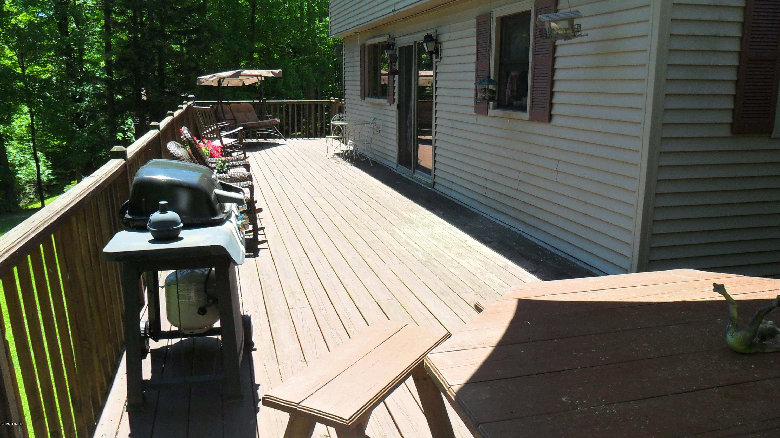 88 Moores Road Florida, MA 01343 - Photo 8 of 53 a view of a balcony with chairs and wooden fence