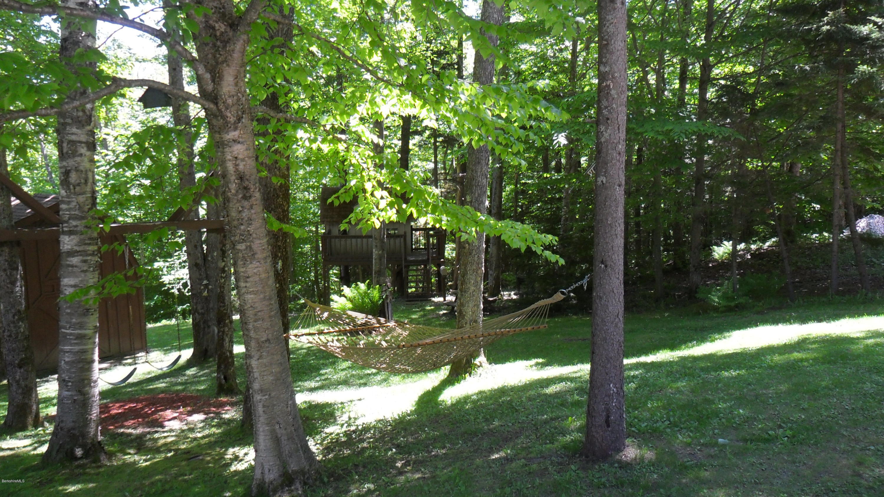 88 Moores Road Florida, MA 01343 - Photo 10 of 53 a backyard of a house with lots of green space and fountain in the back