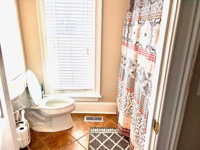 4310 Enoch Road Aynor, SC 29511 - Photo 15 of 39 Full bathroom with curtained shower and tile patterned flooring