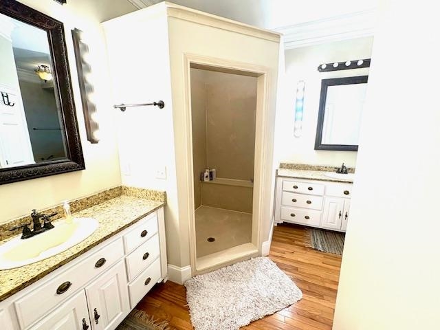 4310 Enoch Road Aynor, SC 29511 - Photo 18 of 39 Bathroom featuring two vanities, light wood finished floors, and crown molding