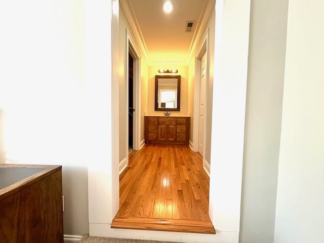 4310 Enoch Road Aynor, SC 29511 - Photo 26 of 39 Hallway featuring light wood-style floors and crown molding