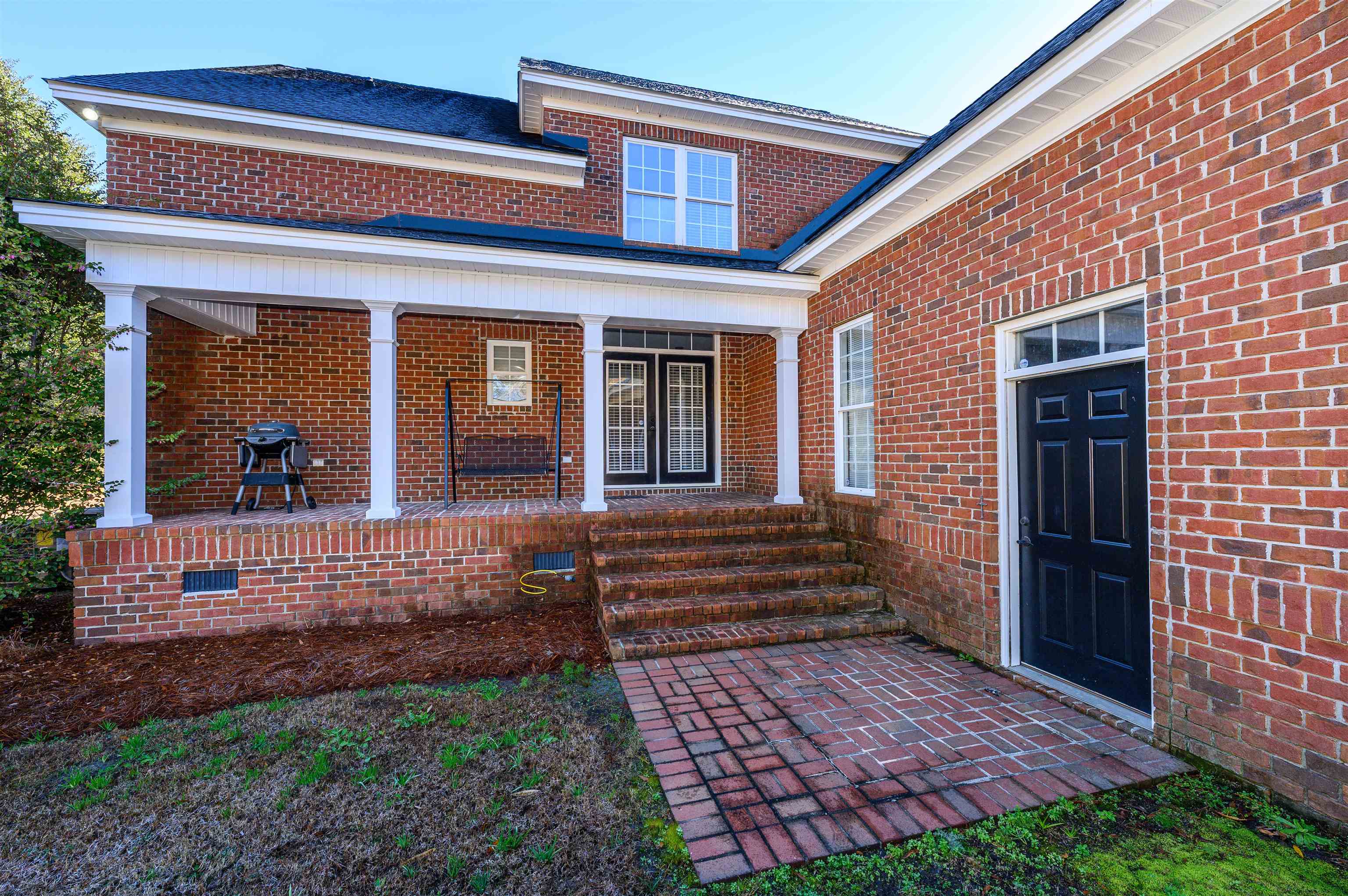 4310 Enoch Road Aynor, SC 29511 - Photo 30 of 39 Entrance to property featuring brick siding and covered porch