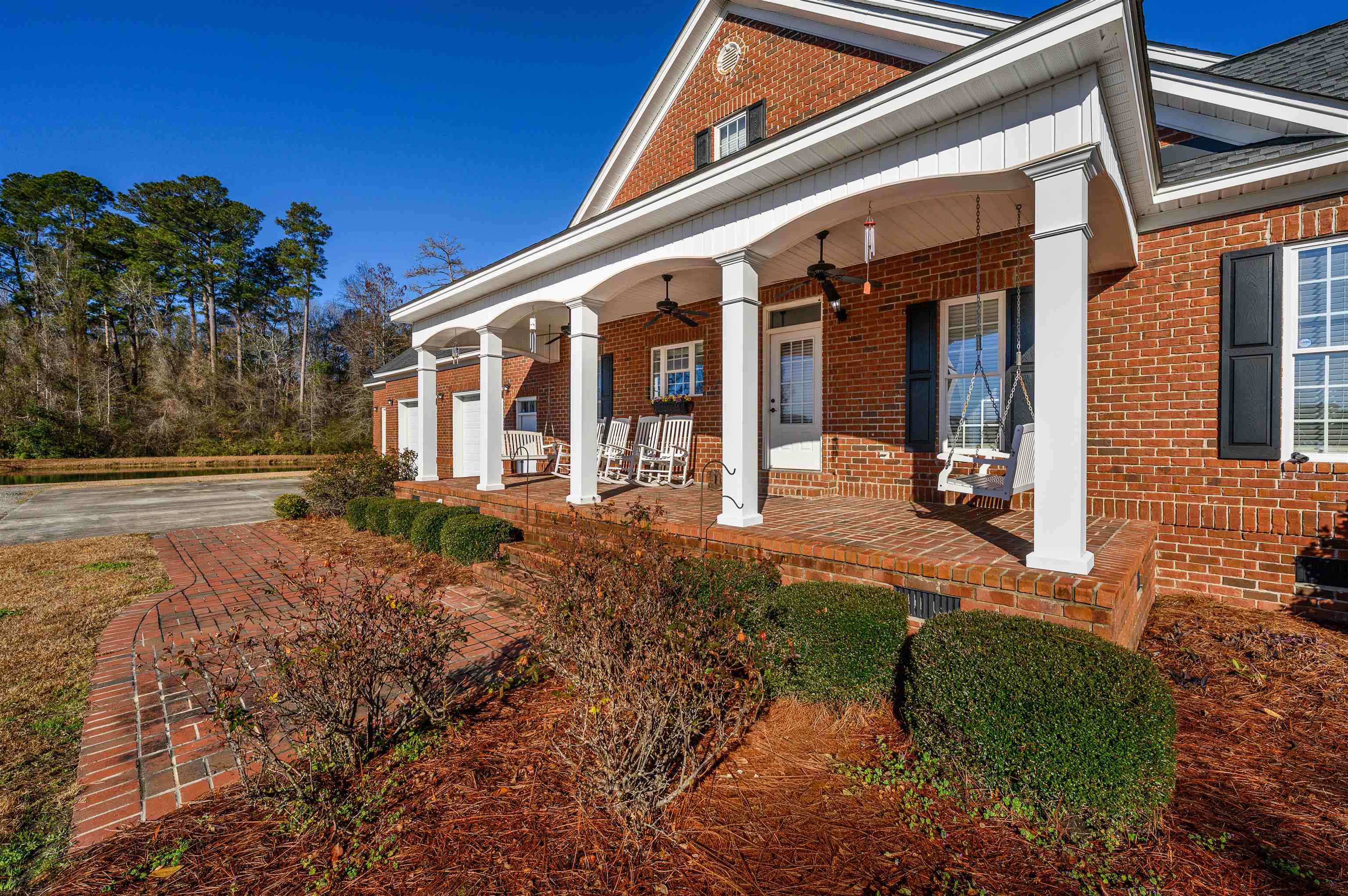 4310 Enoch Road Aynor, SC 29511 - Photo 3 of 39 Entrance to property featuring covered porch, a garage, and brick siding