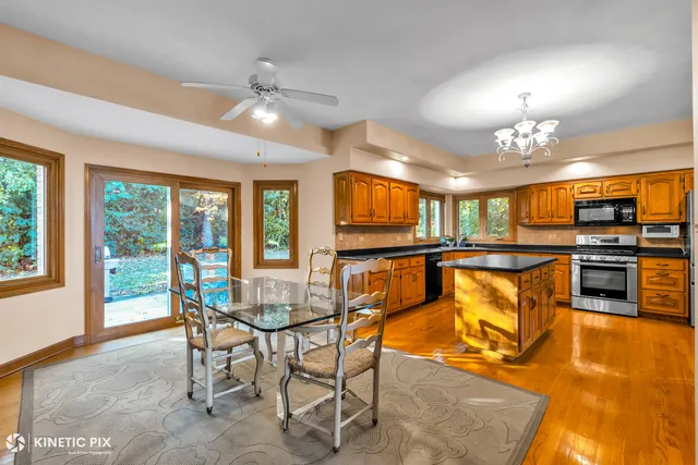 a view of a dining room with furniture window and outside view