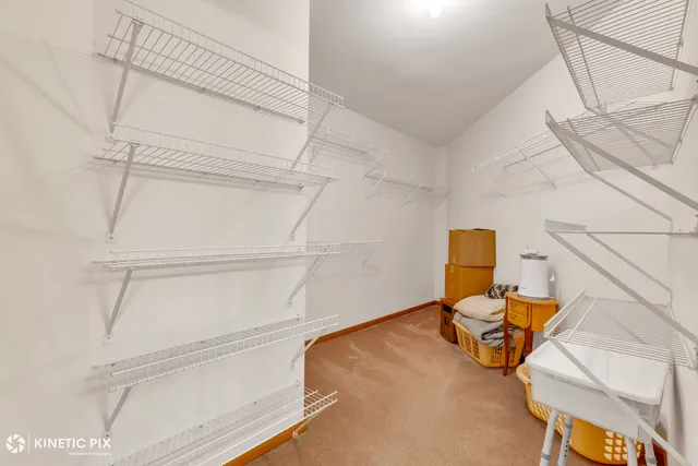 a view of a room with gym equipment and a large window