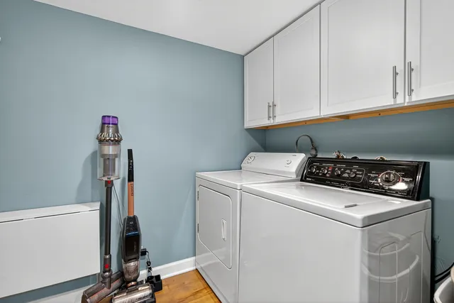 a view of a two chairs in the balcony