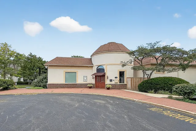 a view of a swimming pool with a lounge chair