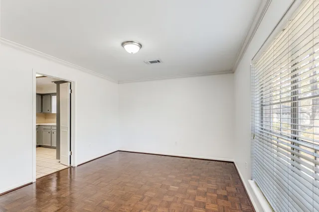 a view of an empty room and window