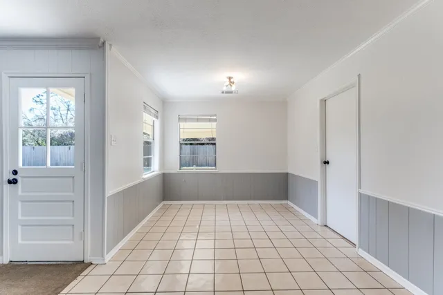 a view of empty room with windows