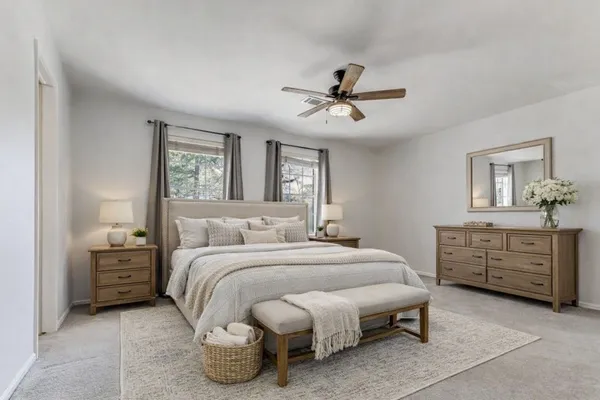 a bedroom with a bed and a dresser