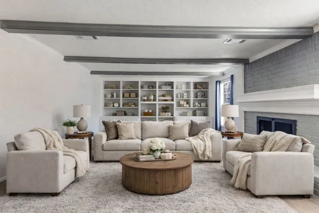 a living room with furniture and a fireplace