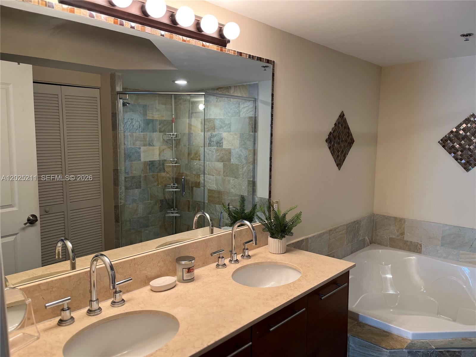 2681 North Flamingo Road, Unit 303S Sunrise, FL 33323 - Photo 10 of 18 a bathroom with a sink and a mirror