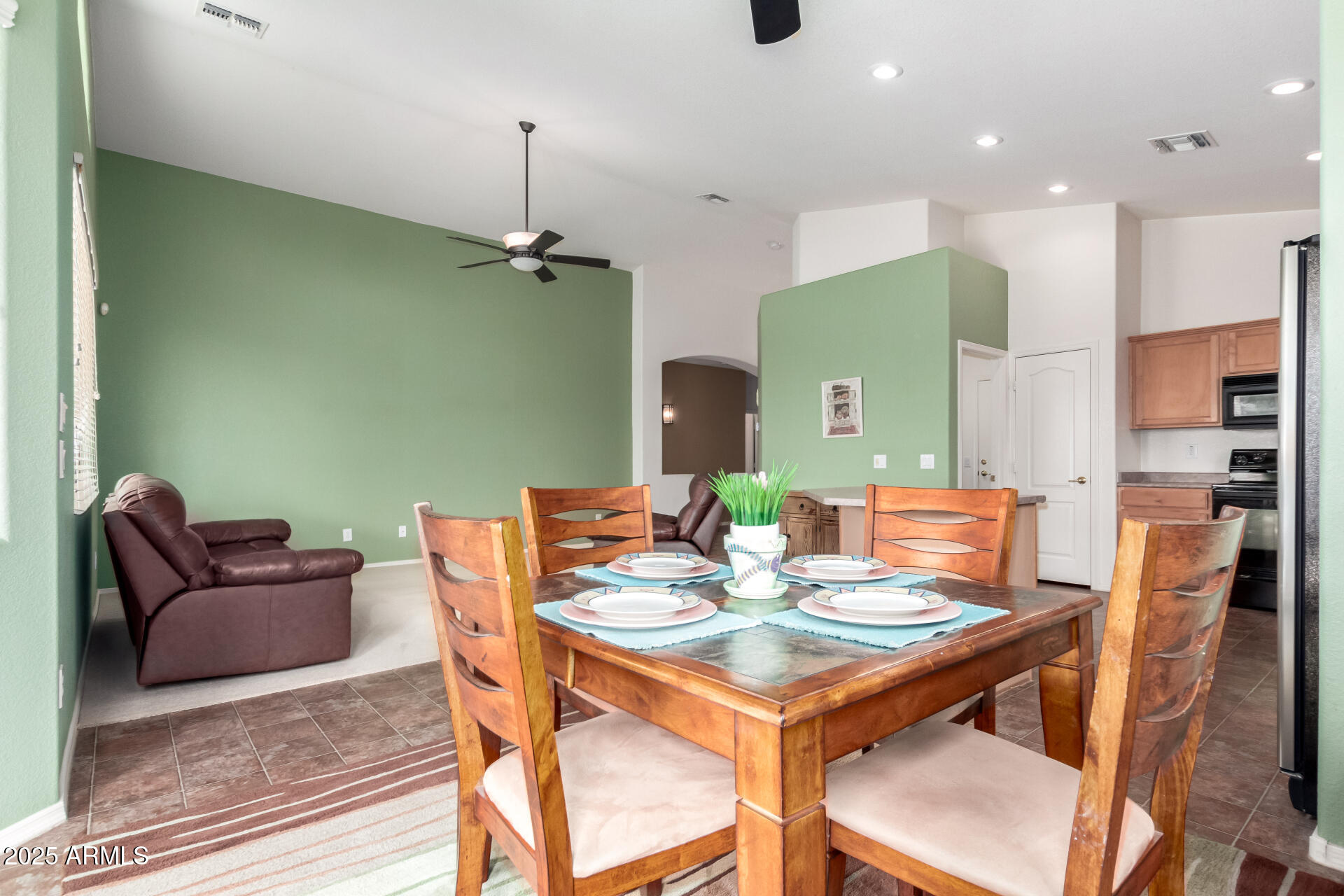 18131 West Addie Lane Surprise, AZ 85374 - Photo 12 of 31 a view of a dining room with furniture
