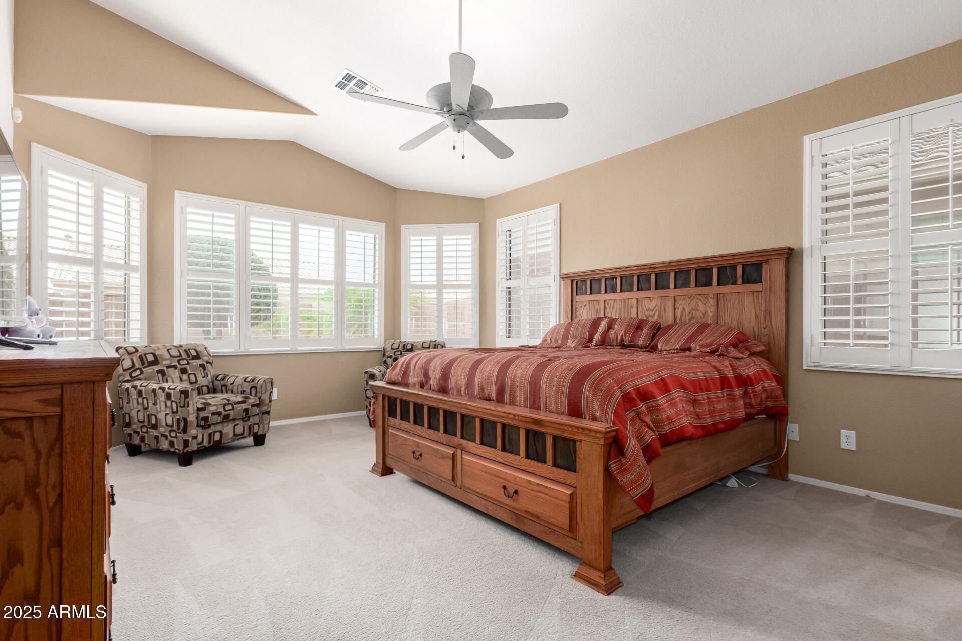 18131 West Addie Lane Surprise, AZ 85374 - Photo 17 of 31 a bed sitting in a bedroom next to a window