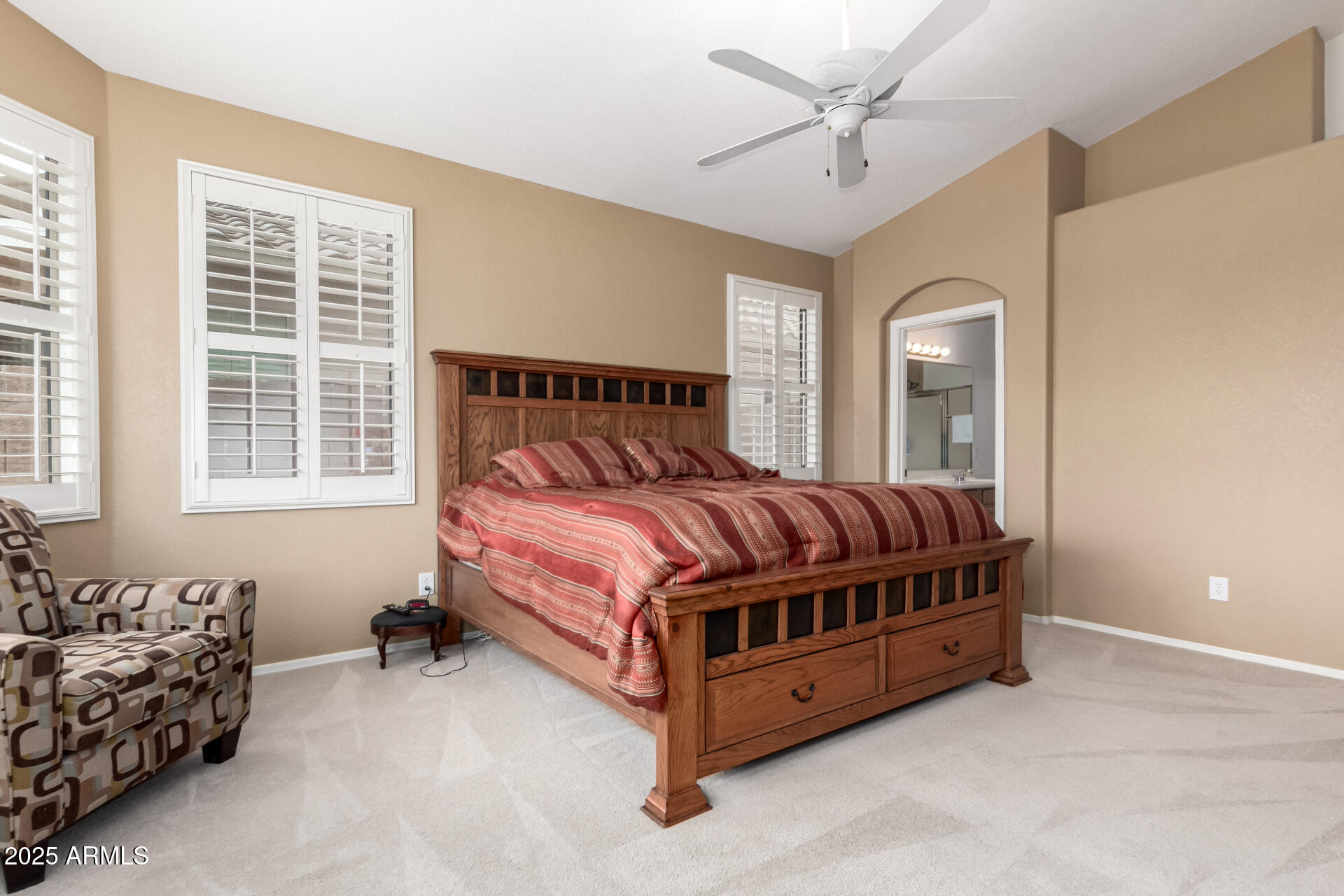 18131 West Addie Lane Surprise, AZ 85374 - Photo 18 of 31 a bed room with a bed and a window