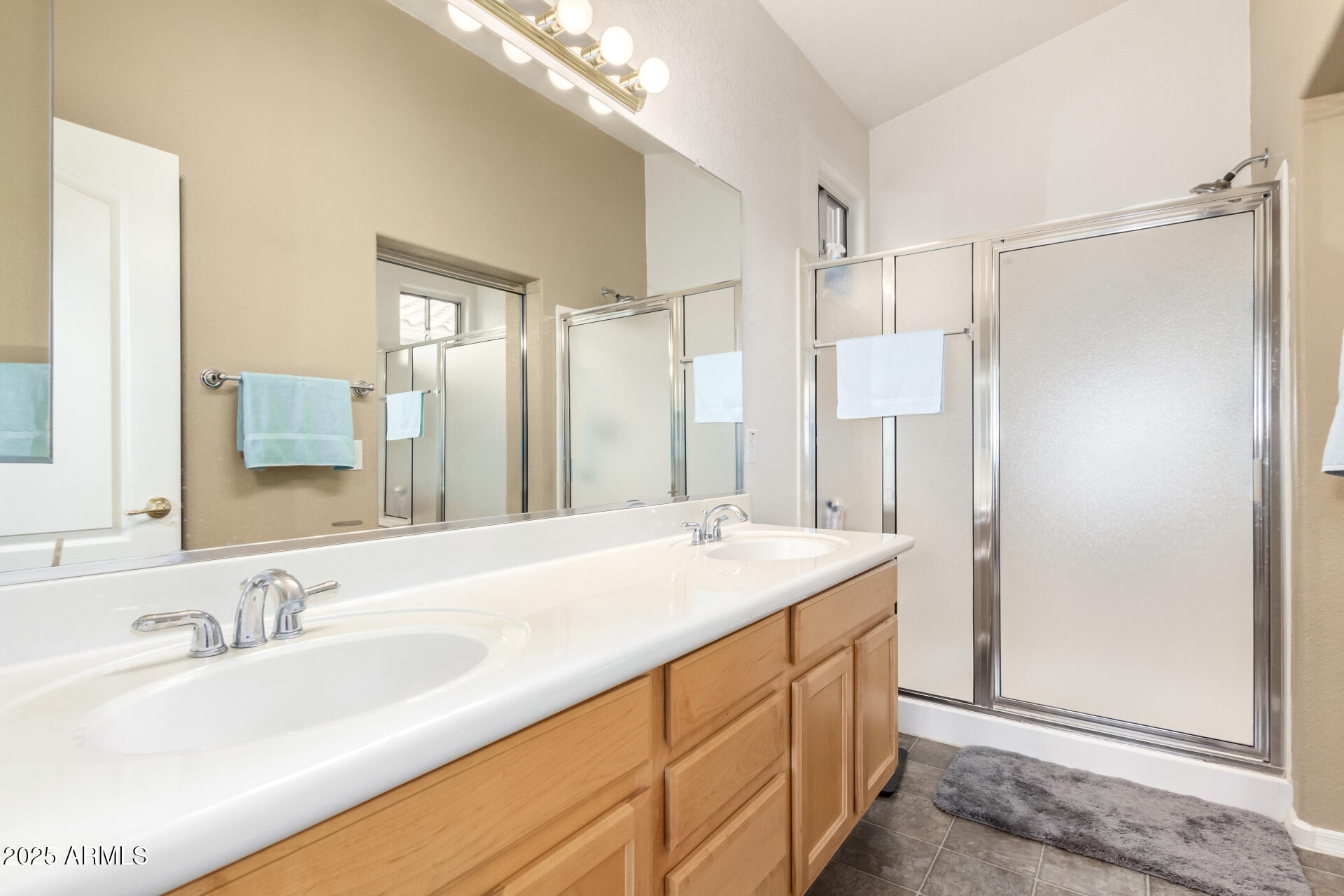 18131 West Addie Lane Surprise, AZ 85374 - Photo 20 of 31 a bathroom with a granite countertop sink mirror and double