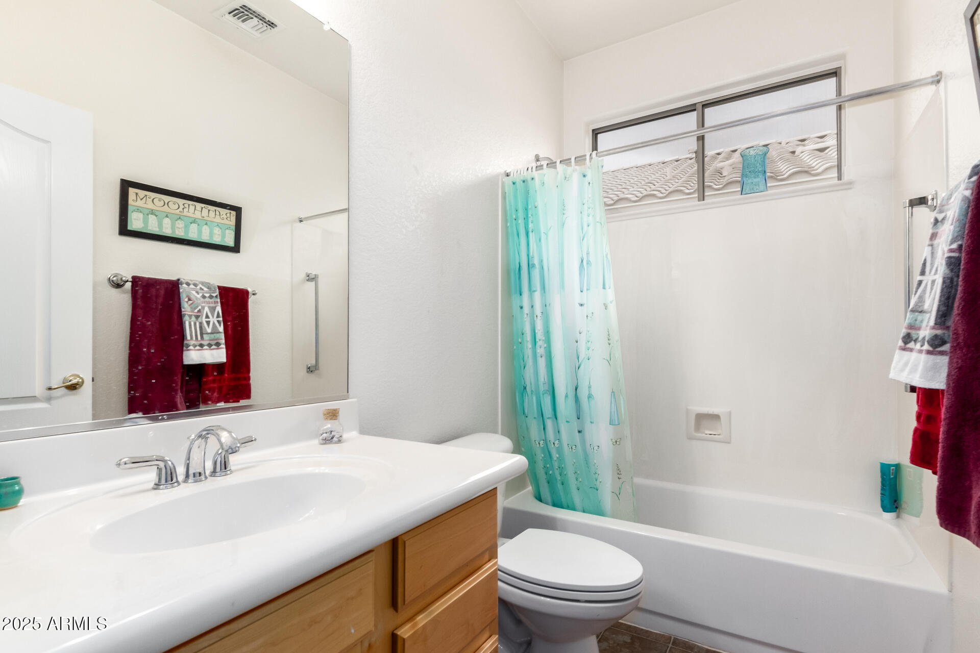18131 West Addie Lane Surprise, AZ 85374 - Photo 25 of 31 a bathroom with a granite countertop sink toilet and shower