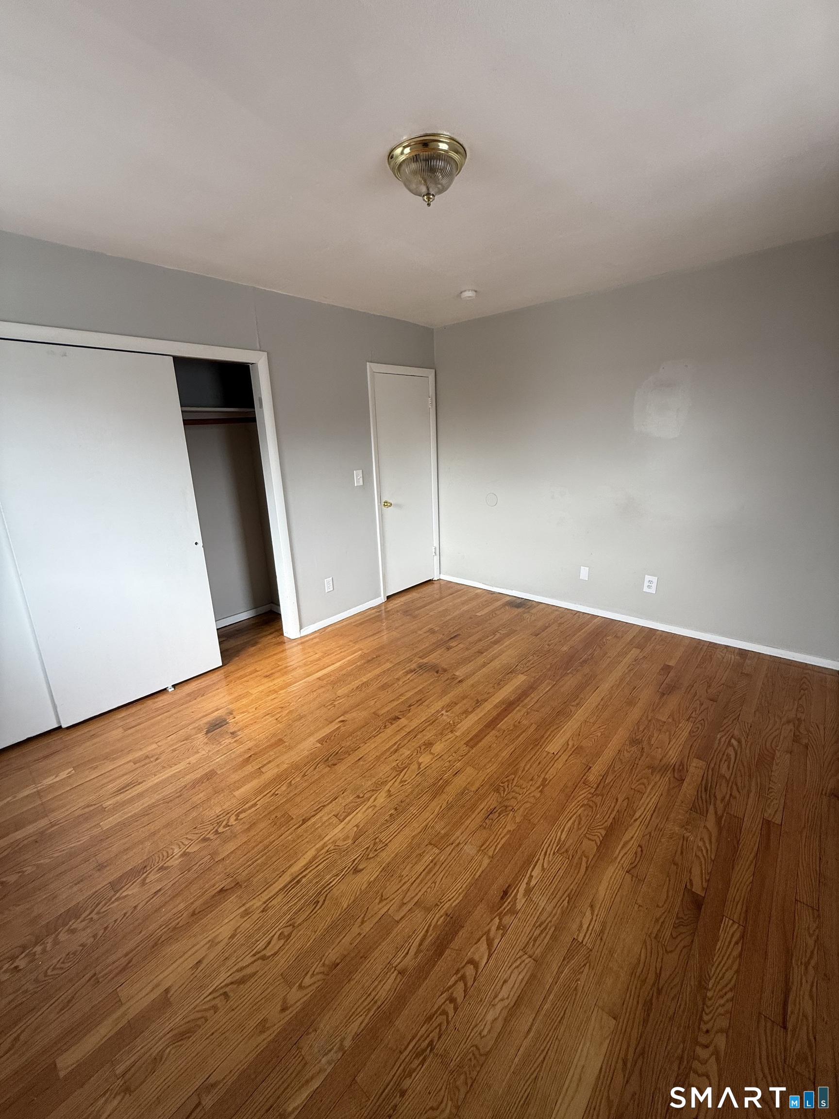 33 Allen Place New Haven, CT 06512 - Photo 11 of 23 a view of empty room with wooden floor