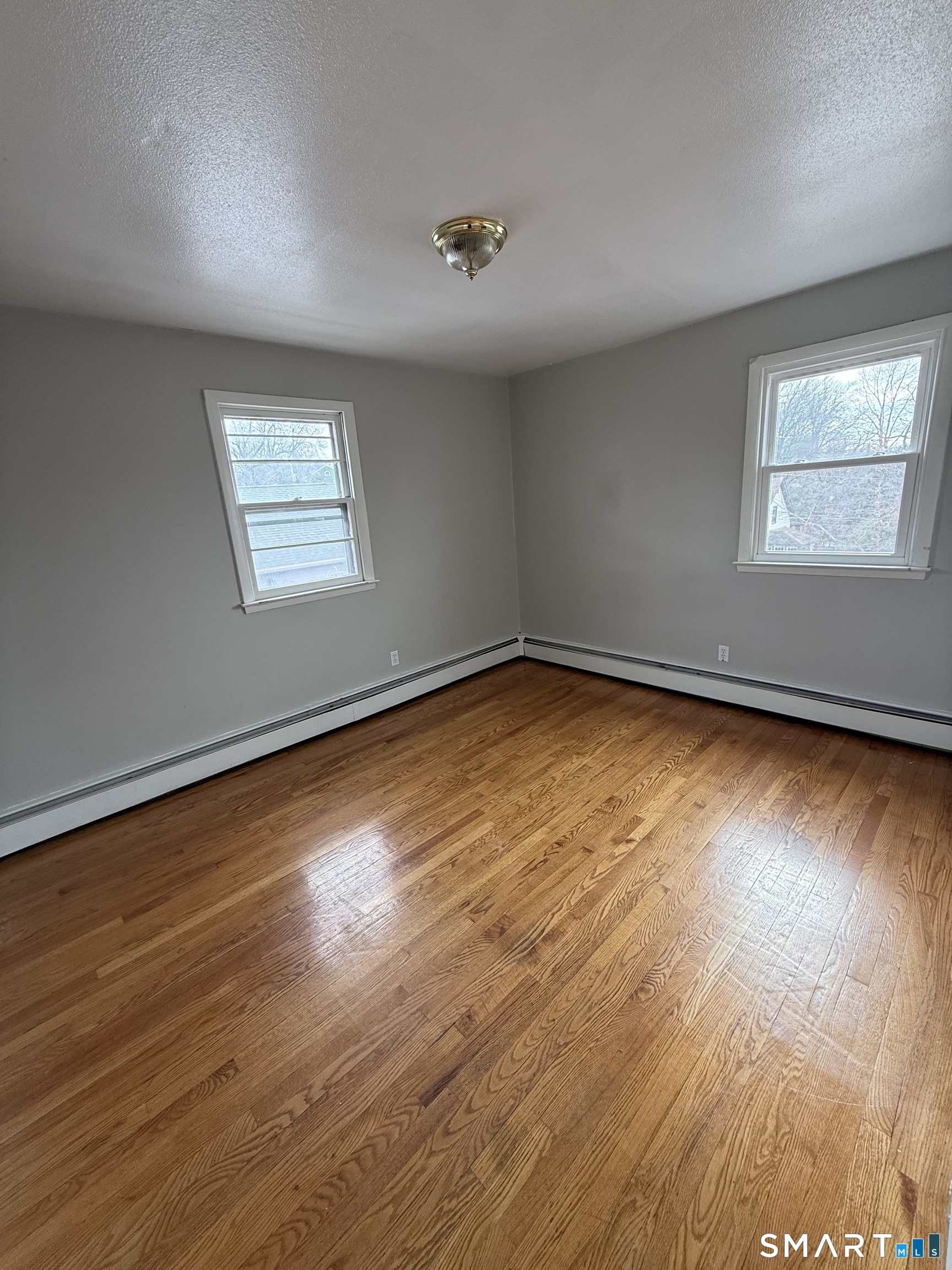 33 Allen Place New Haven, CT 06512 - Photo 12 of 23 a view of empty room with wooden floor and fan