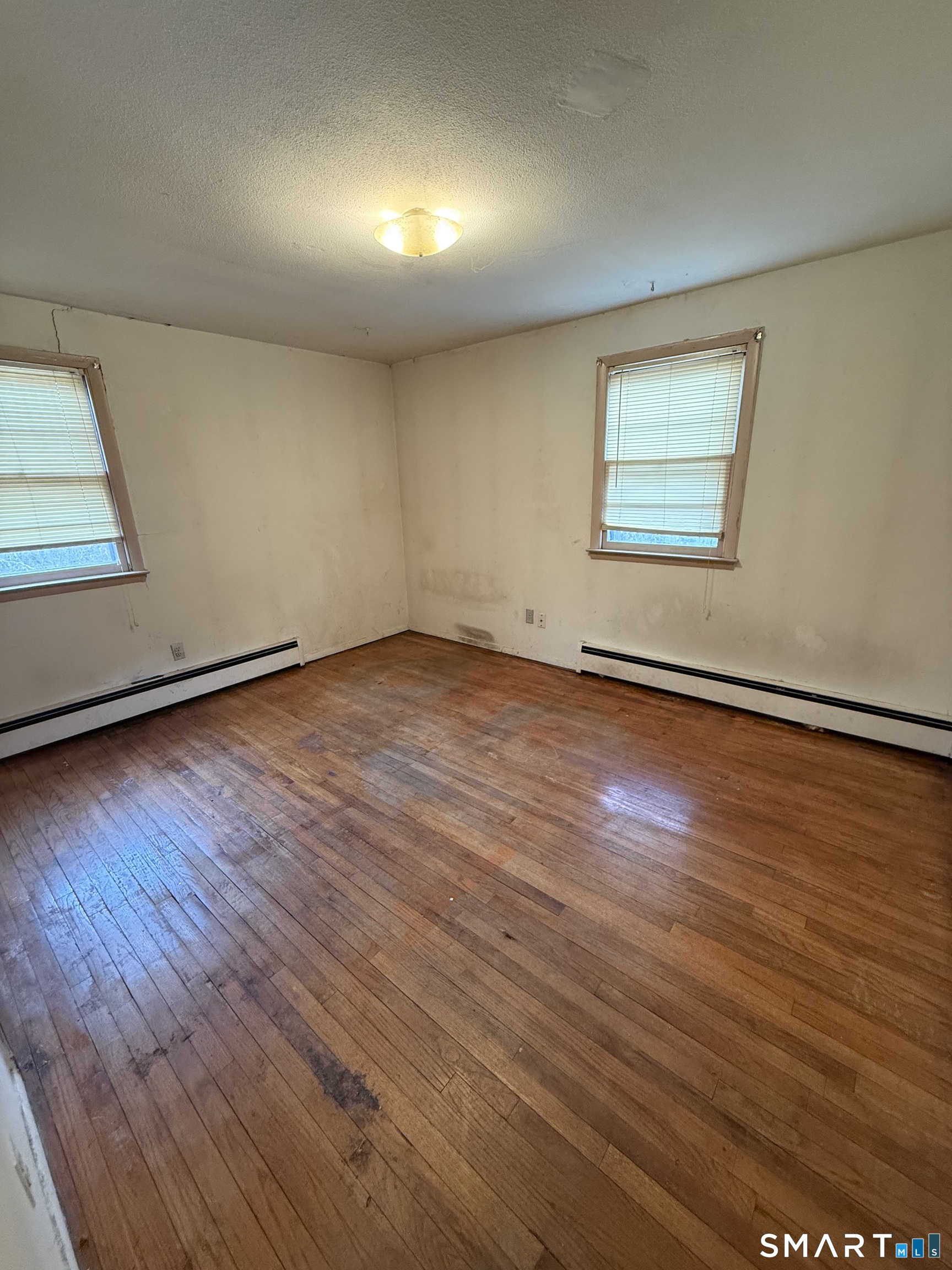 33 Allen Place New Haven, CT 06512 - Photo 19 of 23 an empty room with wooden floor and windows
