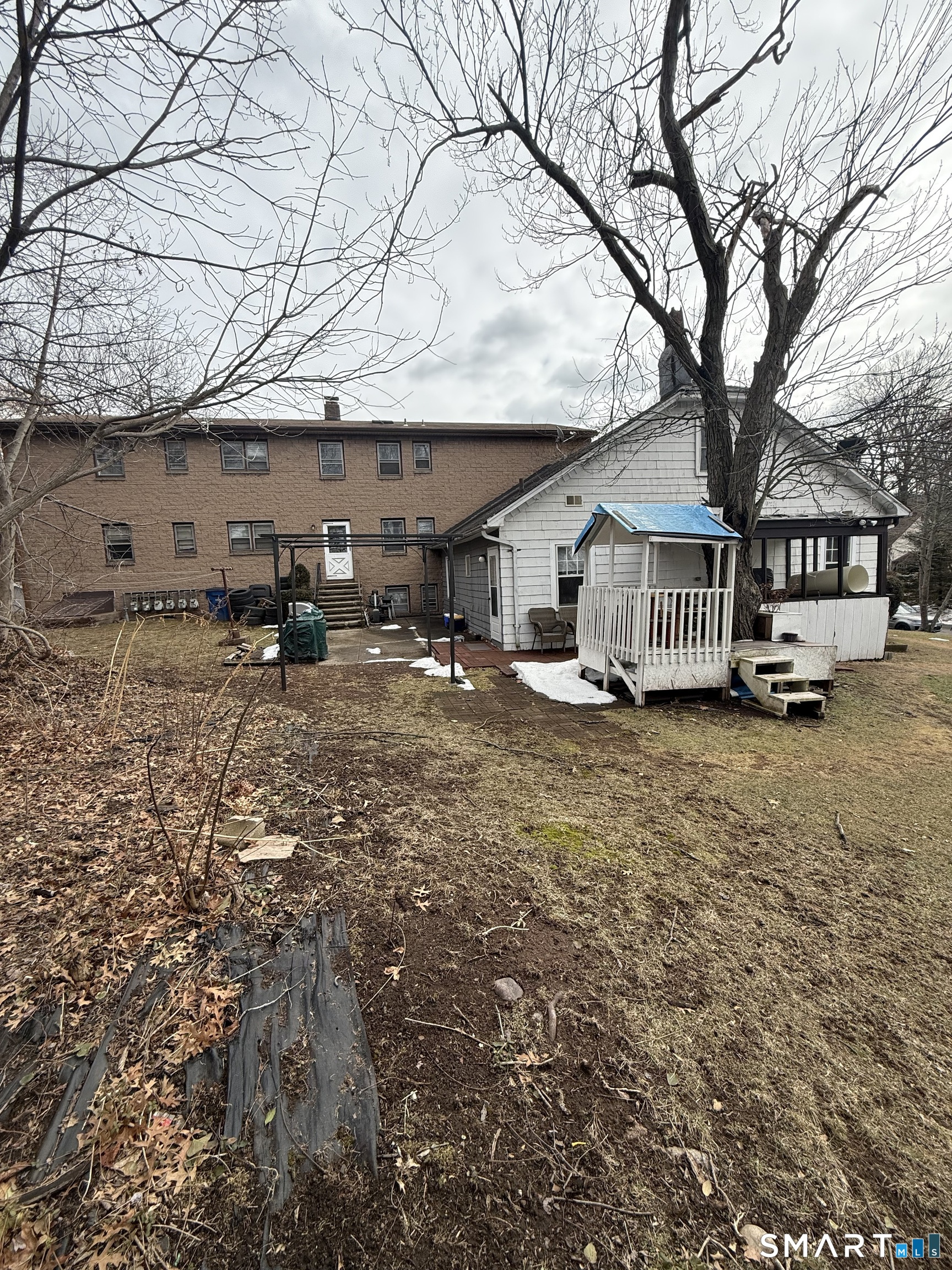 33 Allen Place New Haven, CT 06512 - Photo 4 of 23 a front view of a house with large trees and wooden fence