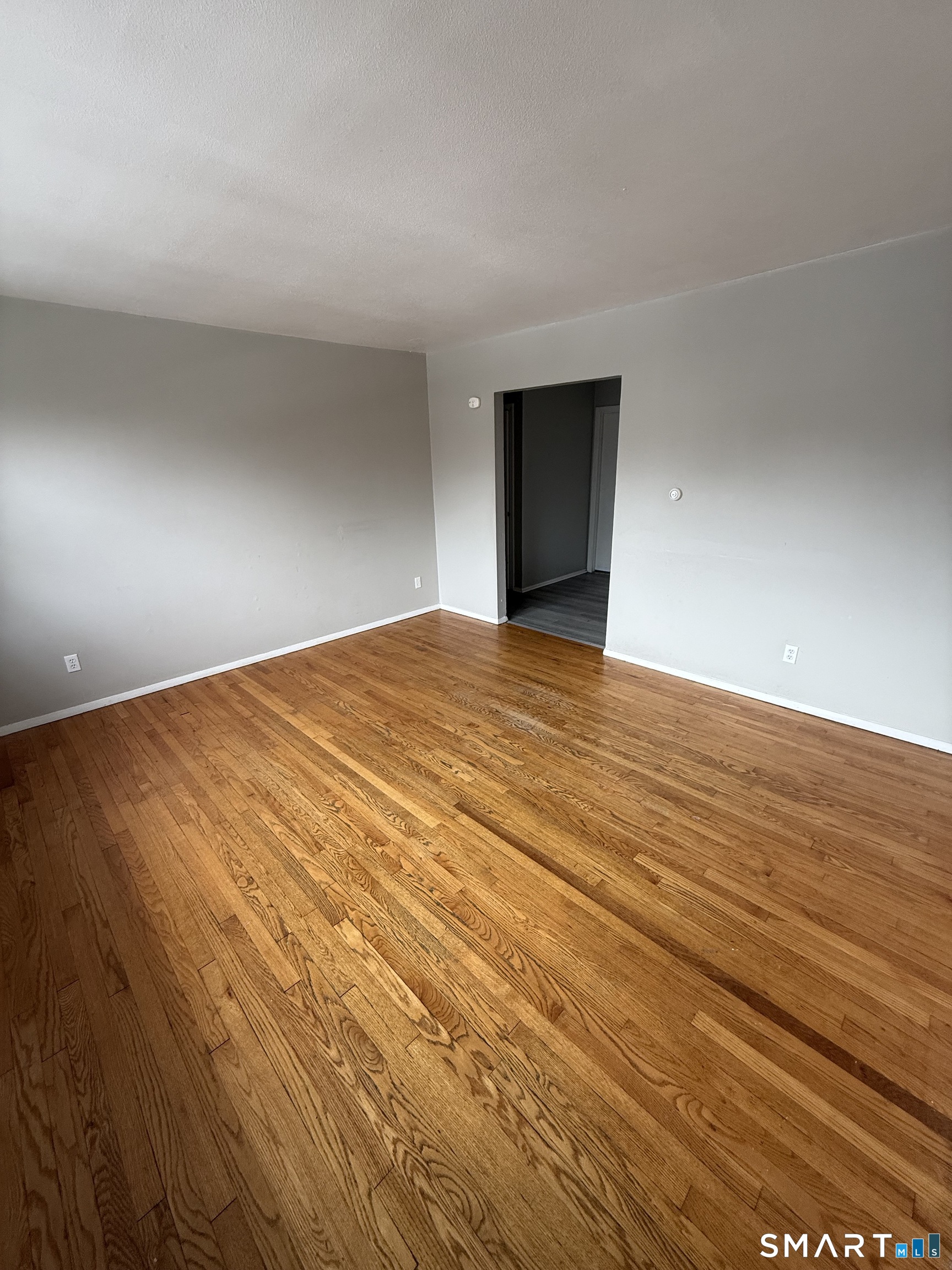33 Allen Place New Haven, CT 06512 - Photo 5 of 23 a view of an empty room with wooden floor