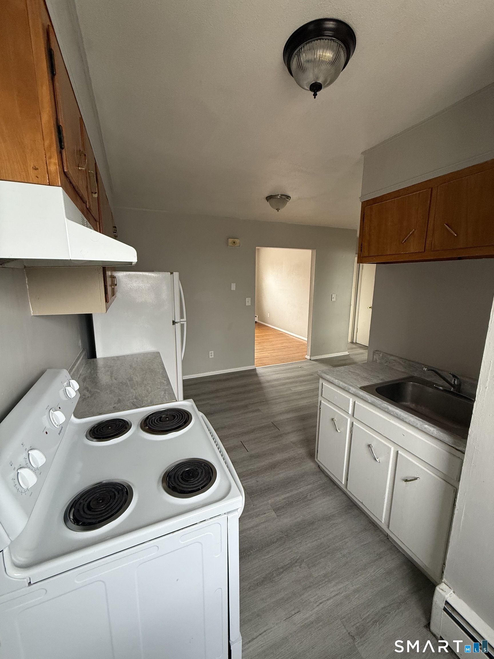 33 Allen Place New Haven, CT 06512 - Photo 8 of 23 a kitchen with a stove and a microwave