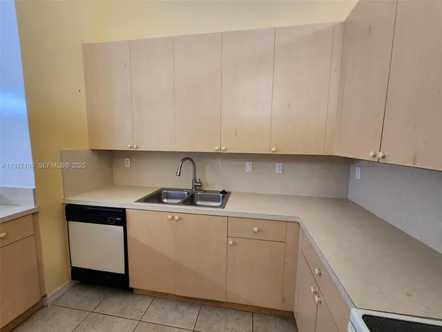 a view of an empty room with a large window