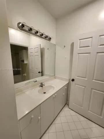 a white toilet sitting next to a bath tub
