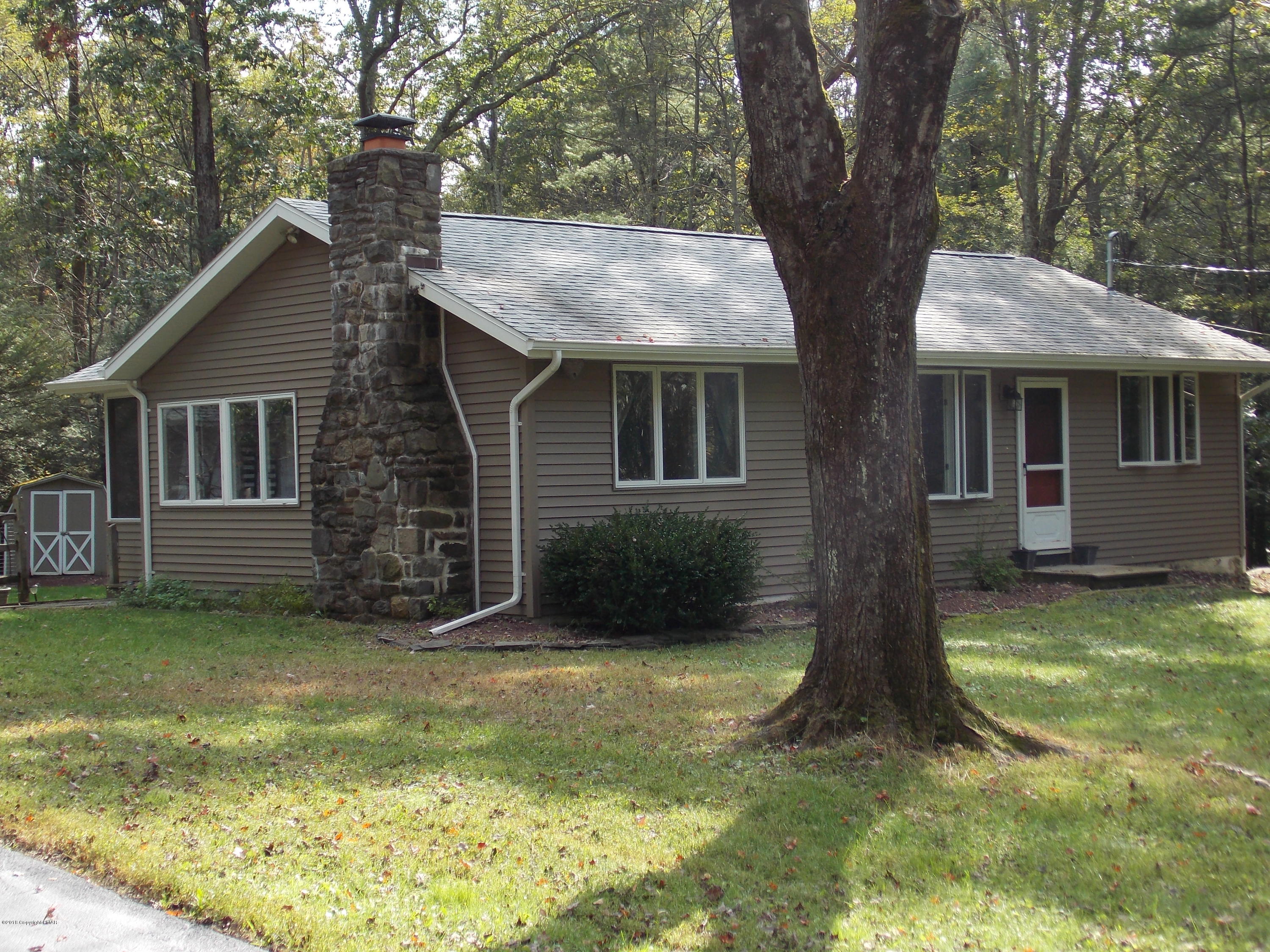 184 Oak Lane Cresco, PA 18326 - Photo 1 of 39 a backyard of a house with seating space