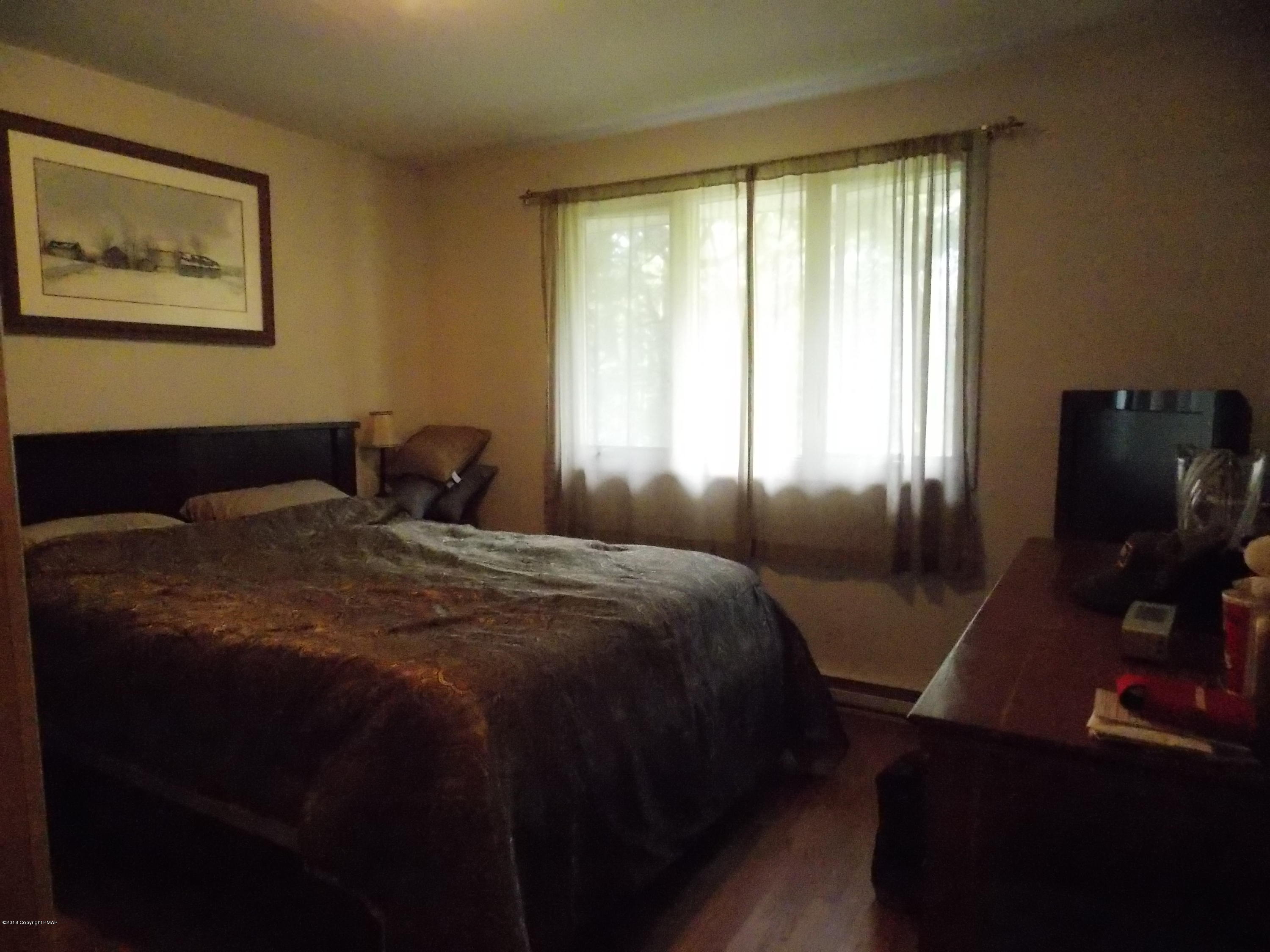 184 Oak Lane Cresco, PA 18326 - Photo 12 of 39 a bedroom with a bed and a window