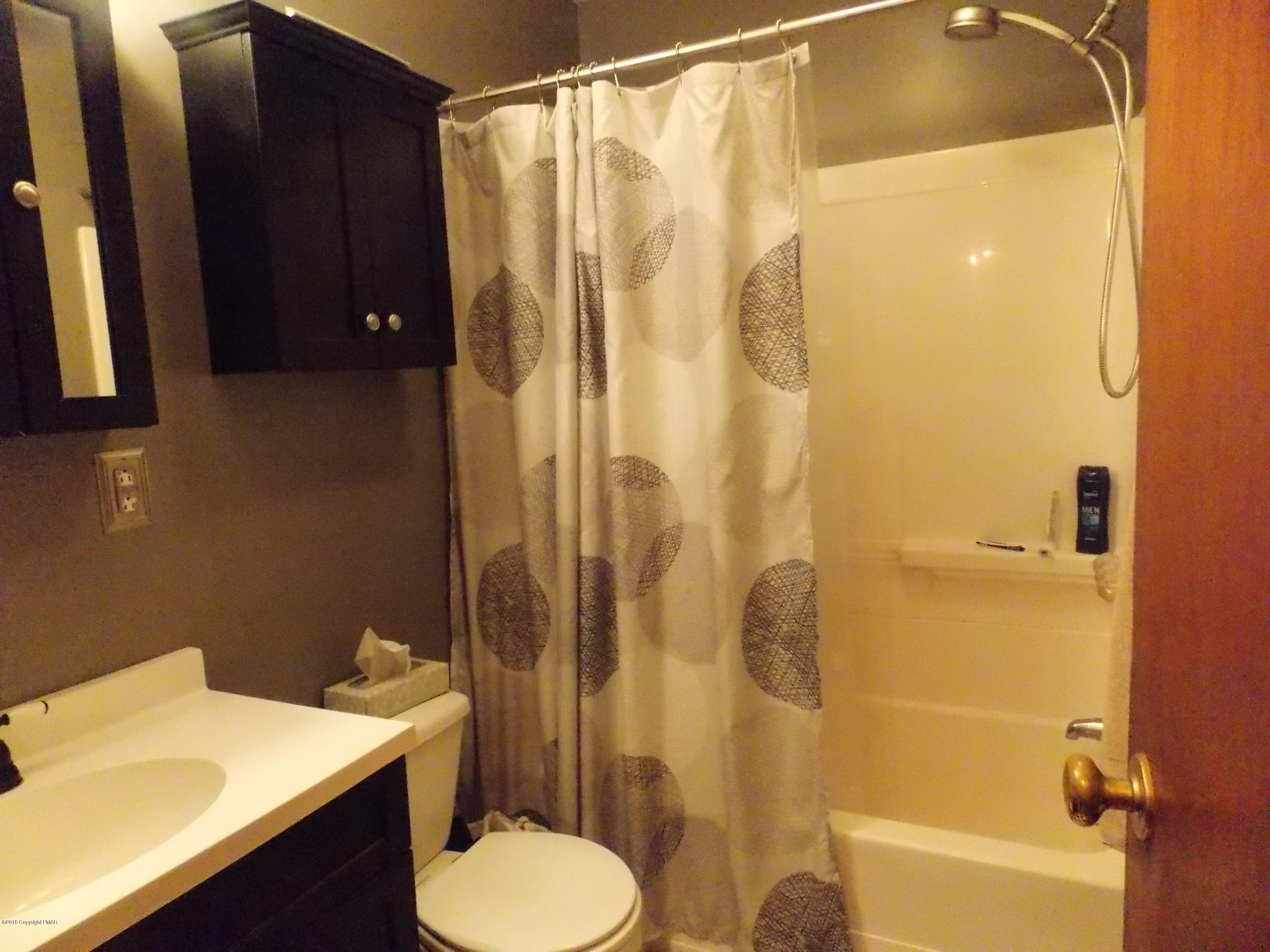 184 Oak Lane Cresco, PA 18326 - Photo 18 of 39 a bathroom with a sink toilet and shower