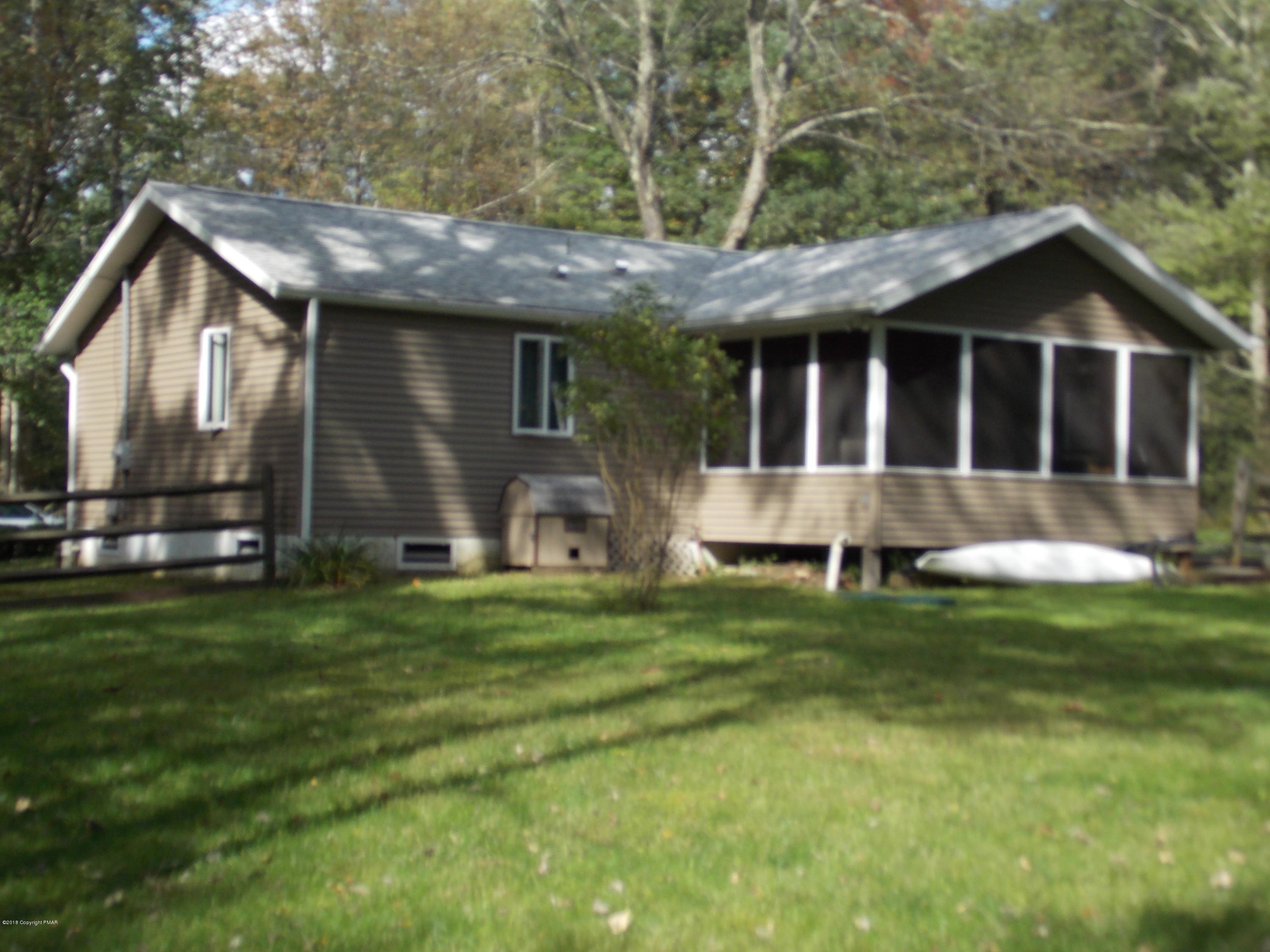 184 Oak Lane Cresco, PA 18326 - Photo 2 of 39 a view of a house with a yard and plants