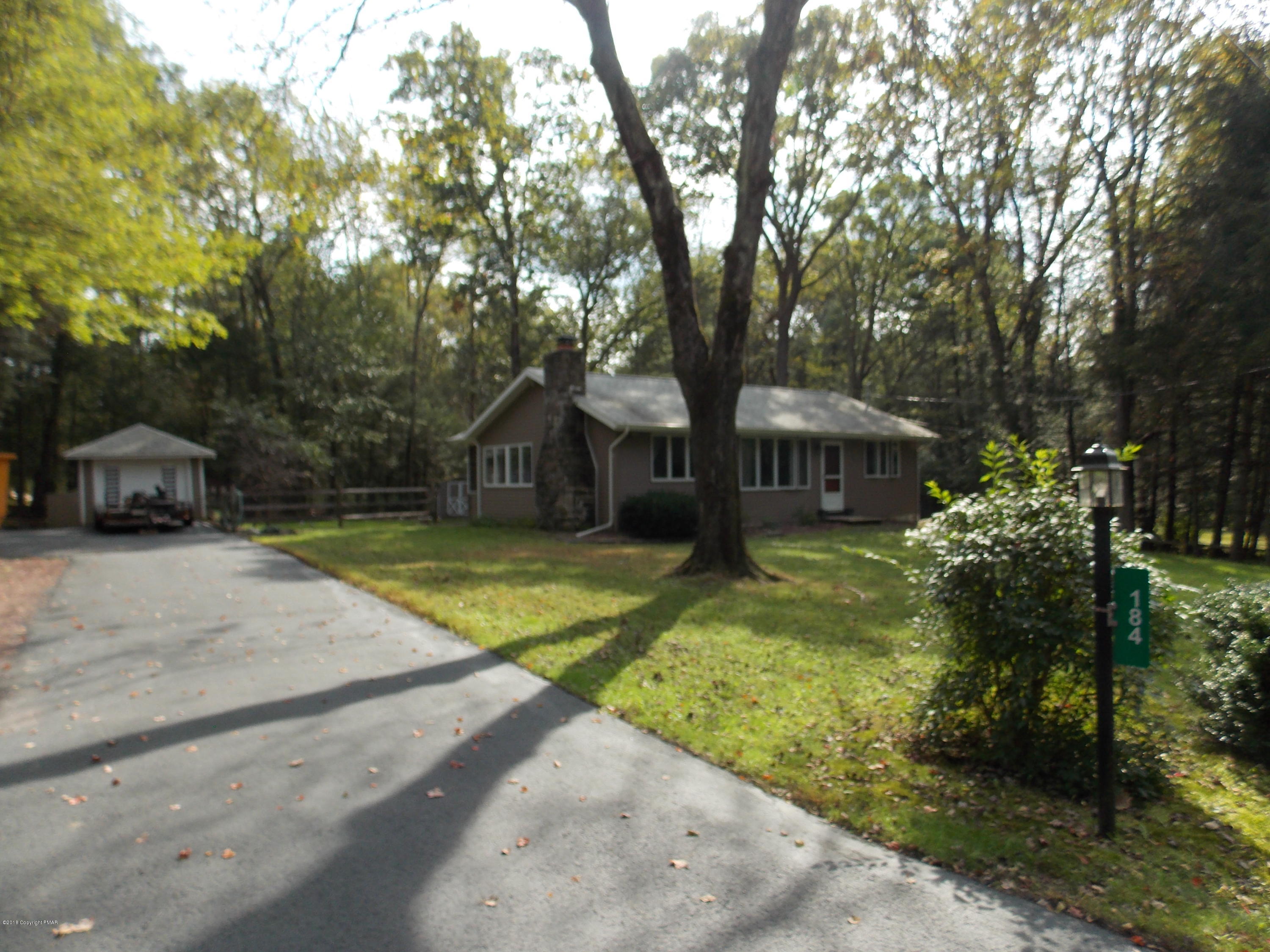 184 Oak Lane Cresco, PA 18326 - Photo 3 of 39 a front view of a house with garden