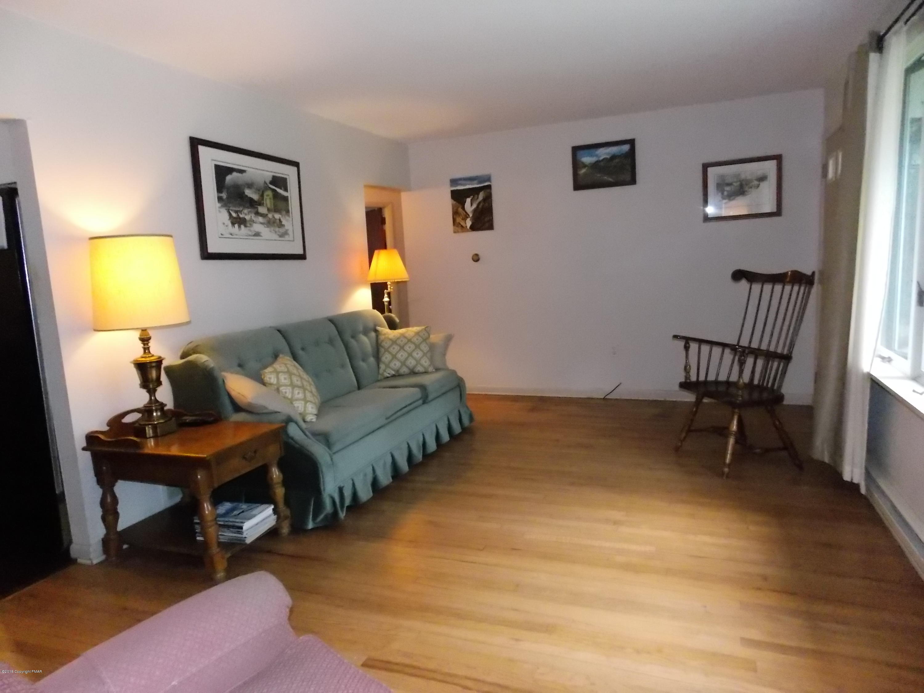 184 Oak Lane Cresco, PA 18326 - Photo 8 of 39 a living room with furniture and a window