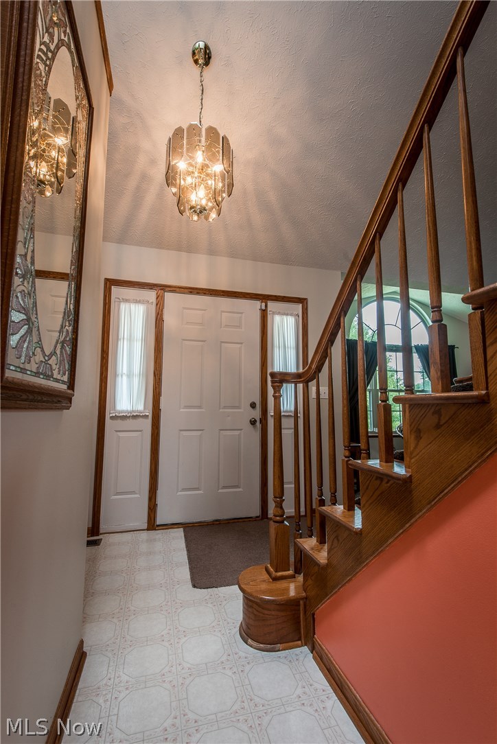 305 Maxwell Road Atwater, OH 44201 - Photo 4 of 28 Vaulted foyer entrance