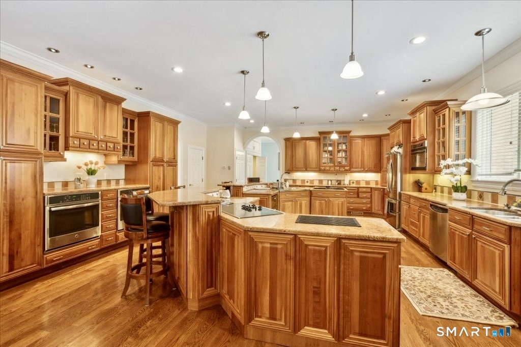 24 Hunting Ridge Drive Simsbury, CT 06070 - Photo 16 of 35 a large kitchen with lots of counter space and a sink