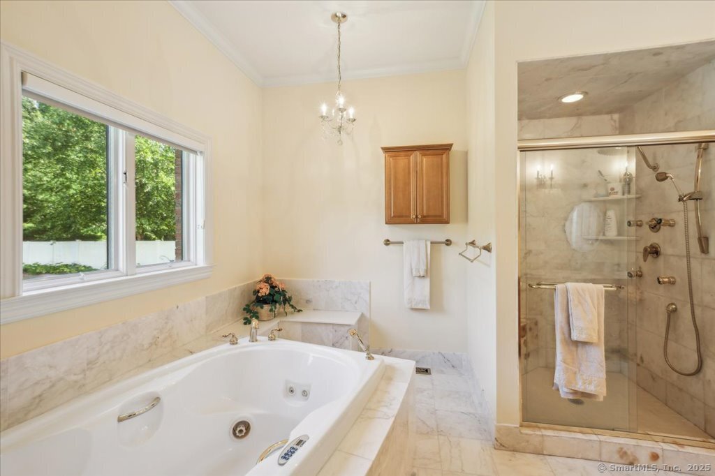 24 Hunting Ridge Drive Simsbury, CT 06070 - Photo 21 of 39 a white bath tub sitting next to a shower
