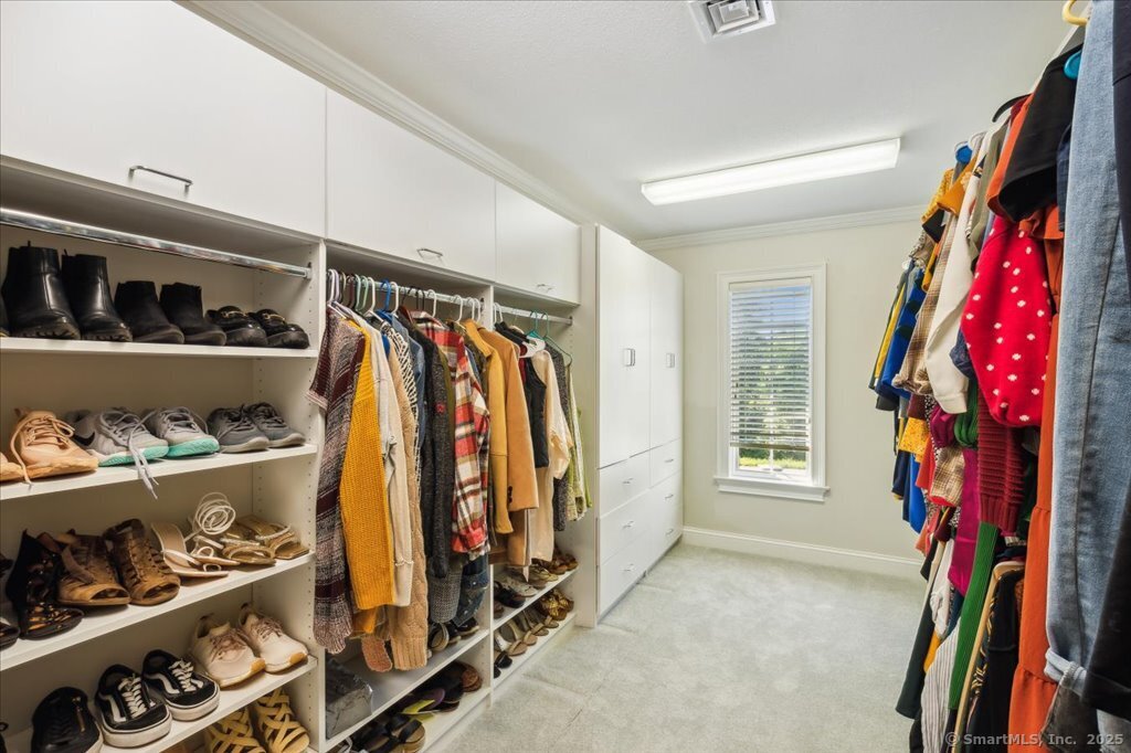 24 Hunting Ridge Drive Simsbury, CT 06070 - Photo 30 of 39 a view of walk in closet with clothes and shoes