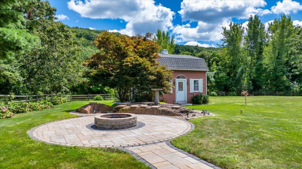 24 Hunting Ridge Drive Simsbury, CT 06070 - Photo 36 of 39 a view of a house with backyard and sitting area